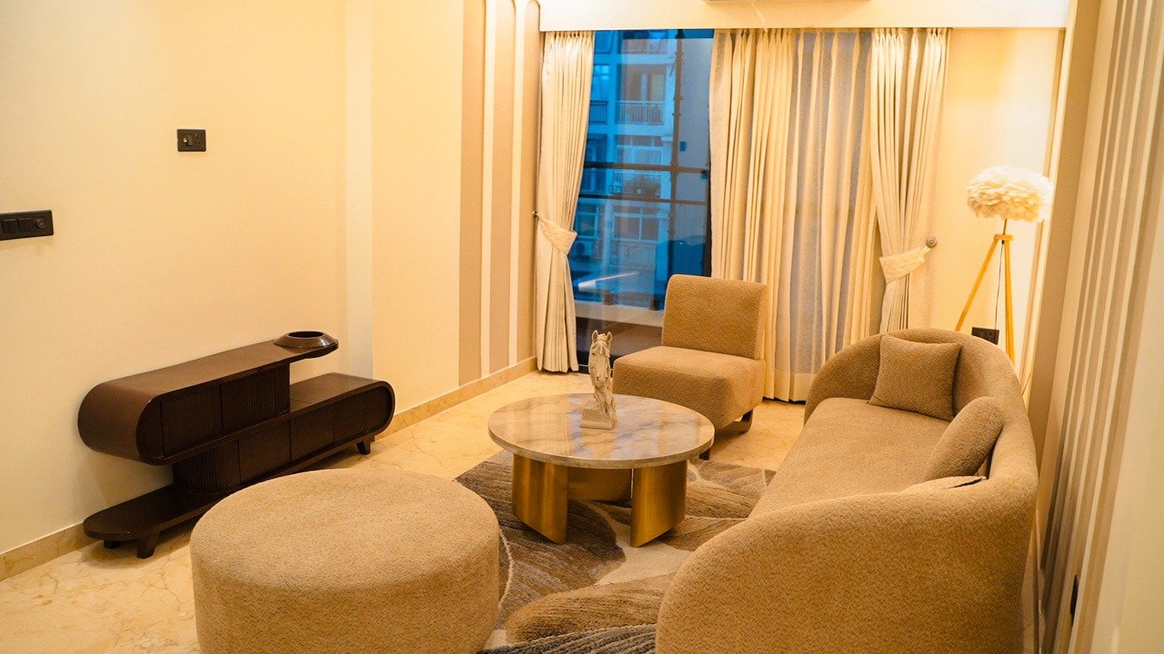 Cozy sitting area in the apartment with comfortable seating, perfect for relaxation and casual conversations.